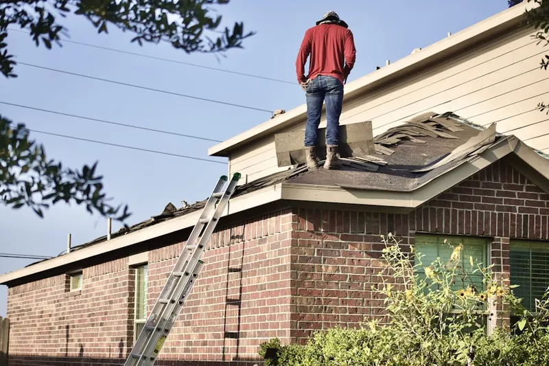 Professional roofer working on a residential roof in Canyon Park